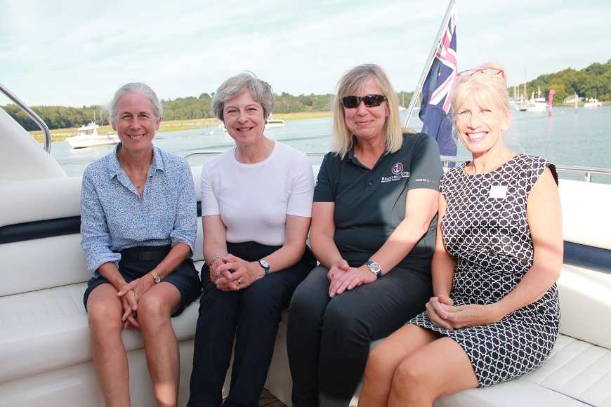 Desktop-news-Mary Montagu Scott, Theresa May, Harbour master Wendy Stowe and Buckler's Hard manager Jane Yapp on the Beaulieu River-(870x580)