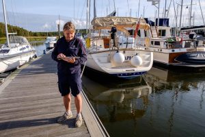 Beaulieu River team member using a wifi enabled tablet in the marina