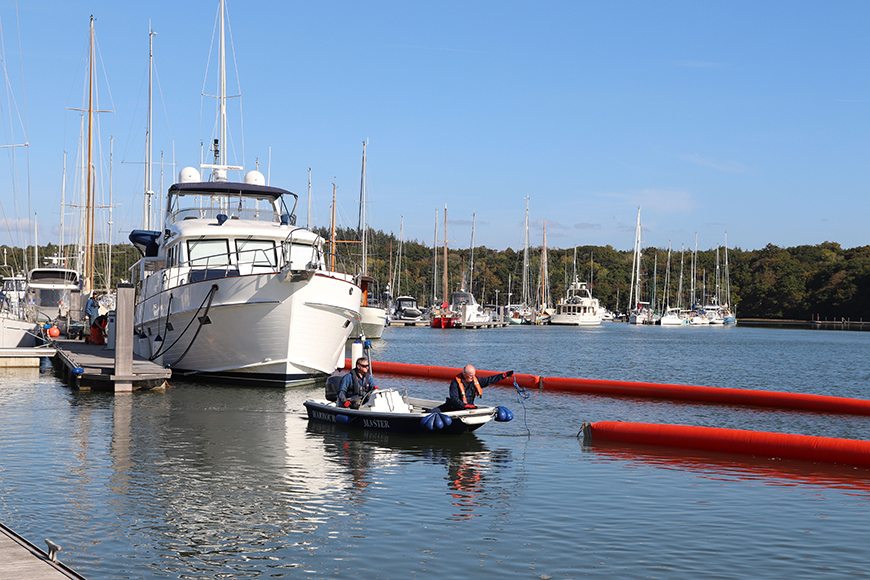 Beaulieu River team members carrying out an oil spill exercise