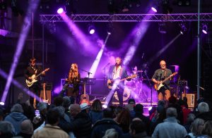 John Illsley and his band performing on stage