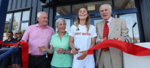 Olympian Vita Heathcote at boatshed opening with Lord Montagu (right), first mooring holder Joanne Husband and newest customer Dewi Thomas