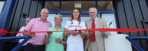 Olympian Vita Heathcote at boatshed opening with Lord Montagu (right), first mooring holder Joanne Husband and newest customer Dewi Thomas